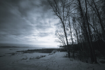 Sunset on the edge of a winter lake