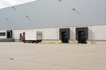 Truck at loading ramps of a warehouse