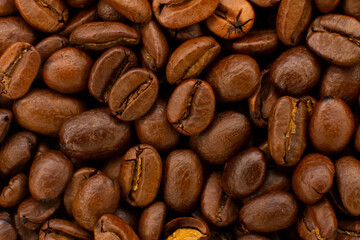 Roasted coffee beans heap isolated on white background can be used as background