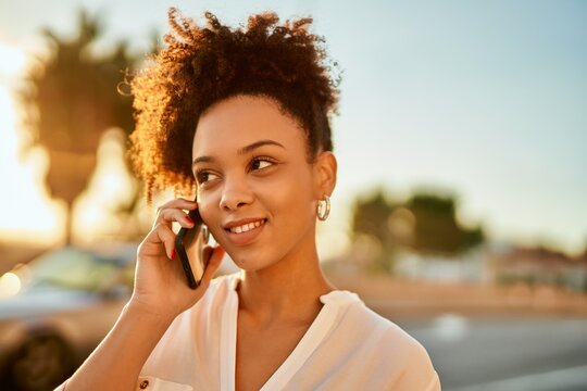 Young african american businesswoman smiling happy talking on the smartphone at the city.