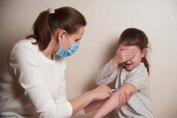 a frightened child is afraid of an injection