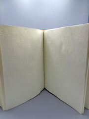 Open notebook, on lectern with blank space for text