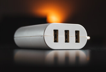 3-port USB charger. White USB hub with electric plug.
