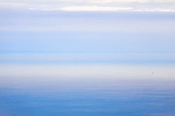 background, waterscape - the morning sea merges with the sky