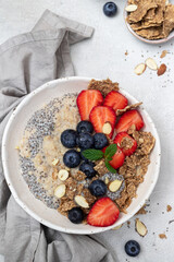 Bowl of fresh homemade oatmeal porridge with  berries. Healthy food for Breakfast.
