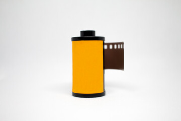 Close-up 35mm film rolls on a white background. 