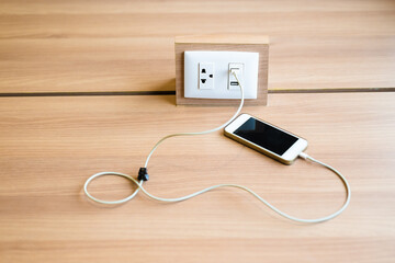 Charging Phone on Built In Plug Table