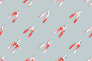 Pliers seamless pattern. Metal pliers with rubber striped grips. Background made of tools. 