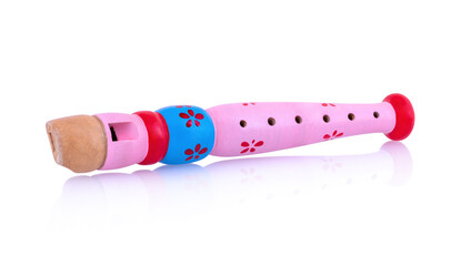 Pink wooden flute isolated on white background with shadow reflection, clipping path, vector path. Colorful recorder for kids. Woodwind musical instrument for children. Musical toy on white backdrop.