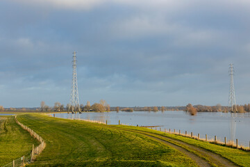 Landscape with the river IJssel overflowing its boundaries into floodplains making its way trough...