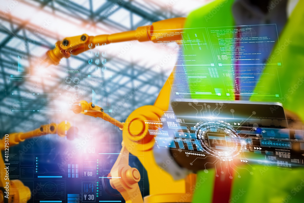 Wall mural industry engineer in factory,using smart tablet glass device,control automation robot arm machine in