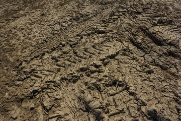 Tyre track on dirt sand or mud, retro tone, grunge tone, drive on sand, off road track.