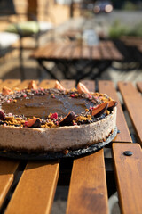 Cinnamon gingerbread cheesecake outside in a cafe