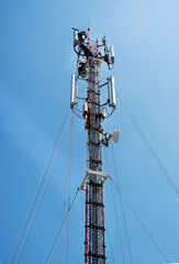  workers are working at 5g antenna tower for maintaining.serves cellular antenna, technician worker repair telecommunication tower on sunlight at background.
