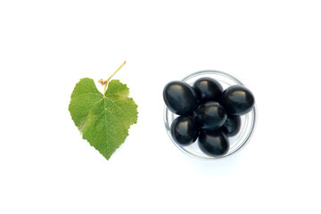 Bunch of dark grapes isolated on the white background.