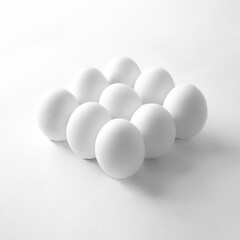 Eggs on a white background. Minimal easter concept. High-key minimalistic photography