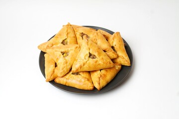 Traditional Tatar Food Triangle Echpochmak (Pie With Meat And Potato) On Black Plate Isolated On White Background. Flat Lay, Top View.