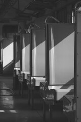 Sunlight and shadow on surface of empty passenger seats on the old train in black and white style