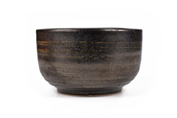 Dark black and brown unglaced ceramic bowl isolated on white background