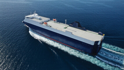 Aerial drone photo of Roll on Roll off vehicle carrier vessel (RO RO) cruising open ocean Mediterranean deep blue sea