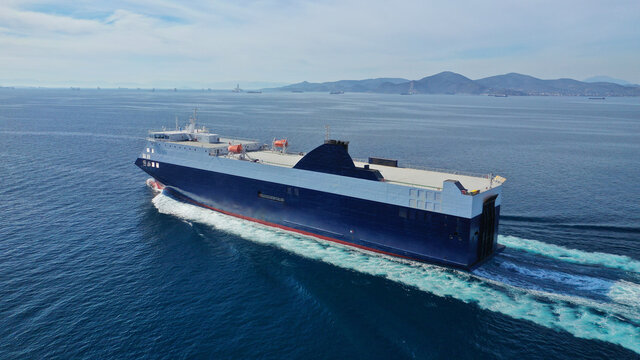 Aerial drone photo of Roll on Roll off vehicle carrier vessel (RO RO) cruising open ocean Mediterranean deep blue sea