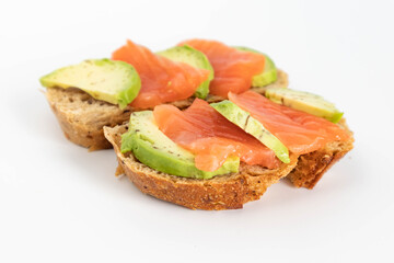 Homemade Toast sandwich with Salmon, Avocado on on a slice of grain bread. healthy food
