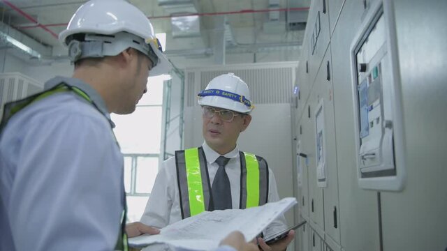 Engineer concept of 4k Resolution. The technician is coordinating the team leader with a communication device.