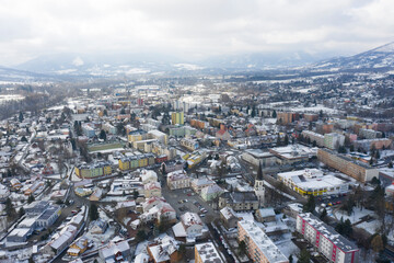 Aerial view of a small town in winter covered in snow