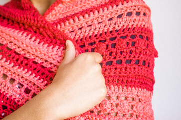 Young girl with red and pink poncho or shawl
