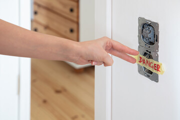 one socket and switcher of the lights installed in the white wall