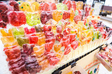 a counter with colorful lollipops of different types
