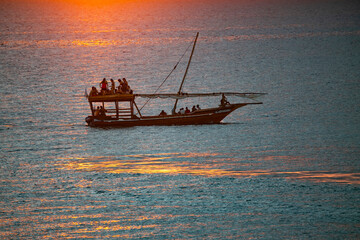 Traditional sailing boat carrying tourists for sightseeing called DHOW on the coast of Zanzibar Islands, Tanzania