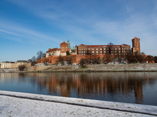 Fototapeta premium Poland, Cracow - view over Vistula River and Wawel Castle, the biggest attraction of Cracow. Winter time
