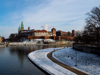 Poland, Cracow - view over Vistula River and Wawel Castle, the biggest attraction of Cracow. Winter time. View over the castle and river boulevards.