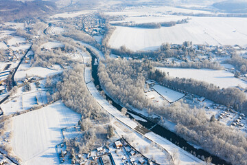 Winter landscape in the Czech Republic with a river and mountains covered in snow 