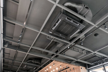 Ceiling mounted cassette type air conditioner in cafe