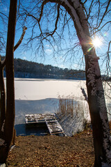 Gangplank to the snowy lake, sunny day with blue sky