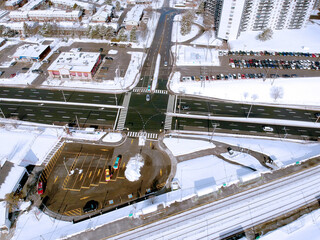 Snow view from the top with urban city, aerial photography over the suburb. Winter scenery of the American city from the bird eye.
