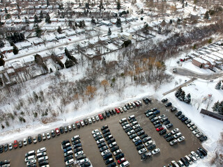 Car parking lot at winter viewed from above. Bird eye aerial view. Canada.