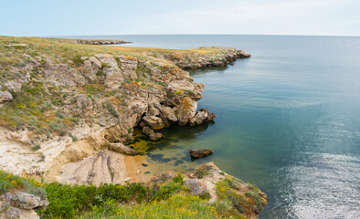 Fototapeta na wymiar rocky sea coast at the bright summer day