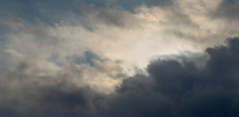 Fototapeta na wymiar Dark storm clouds in the evening dramatic sky