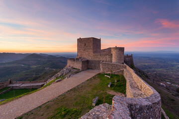 Amazing sunset at Castle Marvao, a small picturesque village in the Alentejo, Portugal. Panoramic view landscape. This landmark is an amazong travel destination.