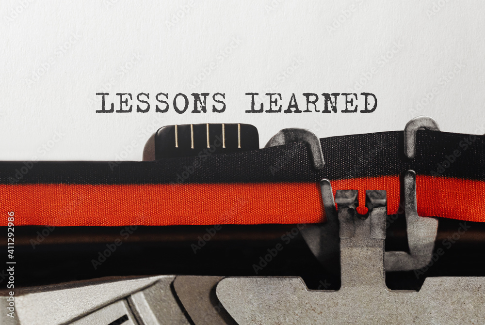 Poster text lessons learned typed on retro typewriter
