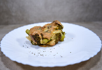 Piece of baked broccoli casserole on the plate