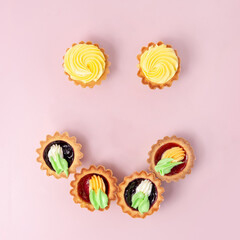 Yummy fruit tarts in shape of emoticon