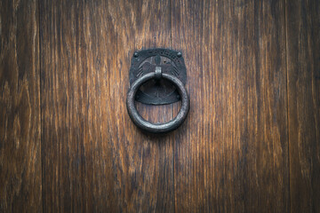 ancient door handle on old wood door