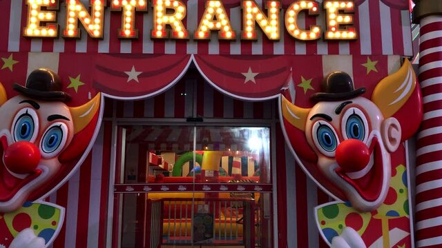 Entrance of the carnival fair with clowns