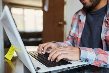 Young mature man taking classes online