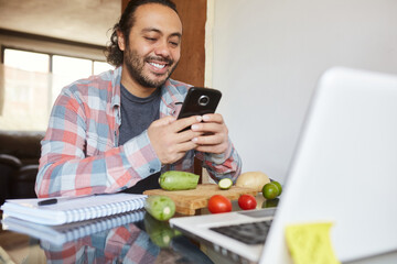 Young mature man taking cooking classes online