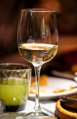 glass with drink and glass with lemonade on festive dark blurred background, vertical